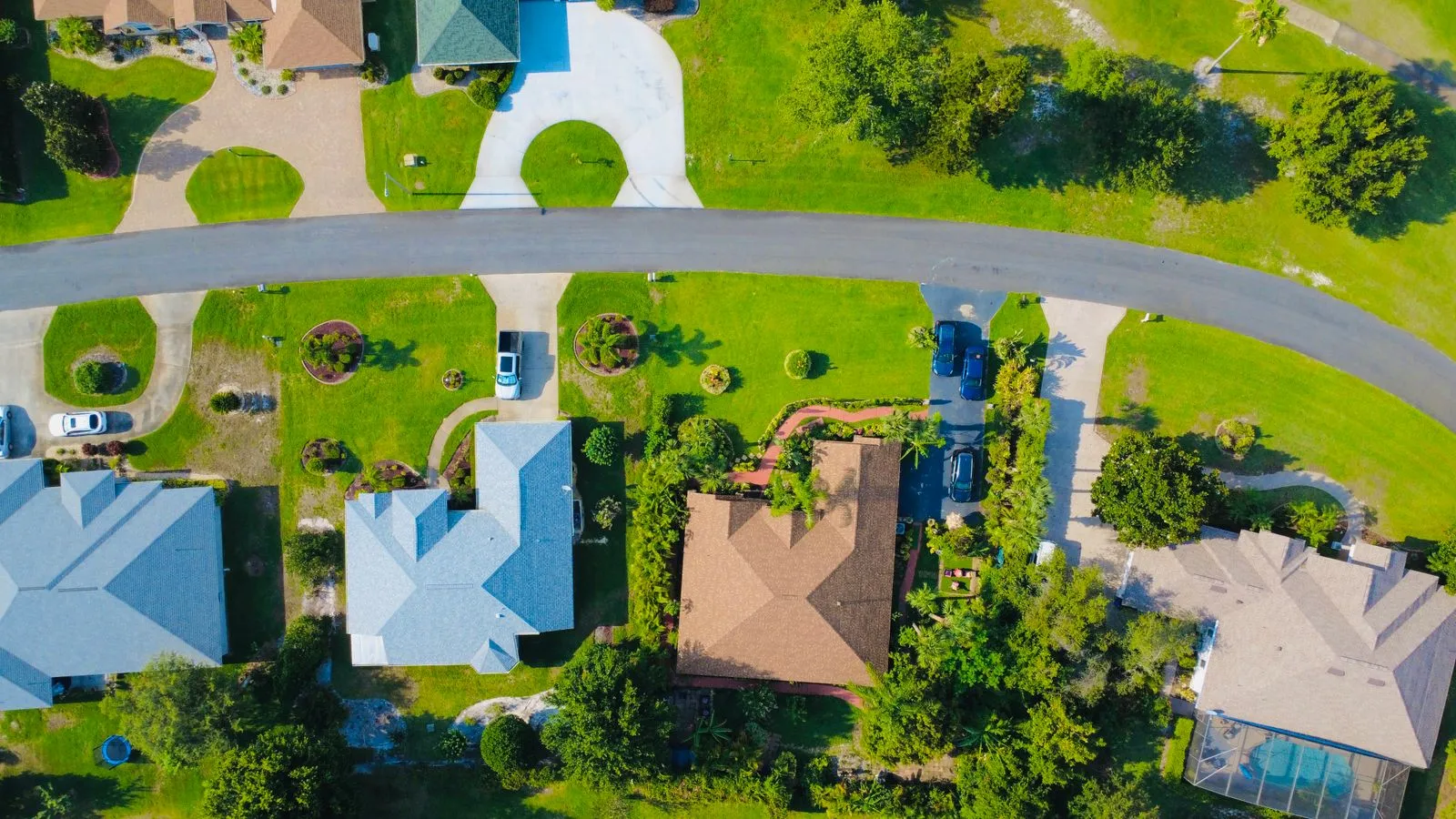 Aerial view of suburban homes and rooftops in a neighborhood