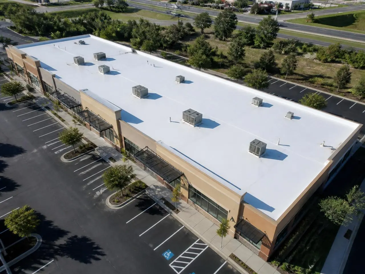 White TPO commercial flat roof on a retail building in Woodstock, GA