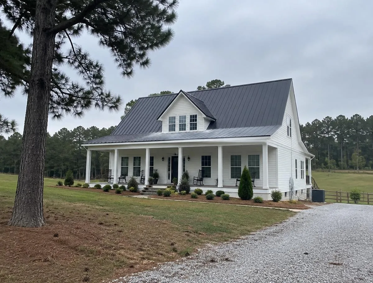 Charcoal standing seam metal roof on a white farmhouse near Ball Ground, GA