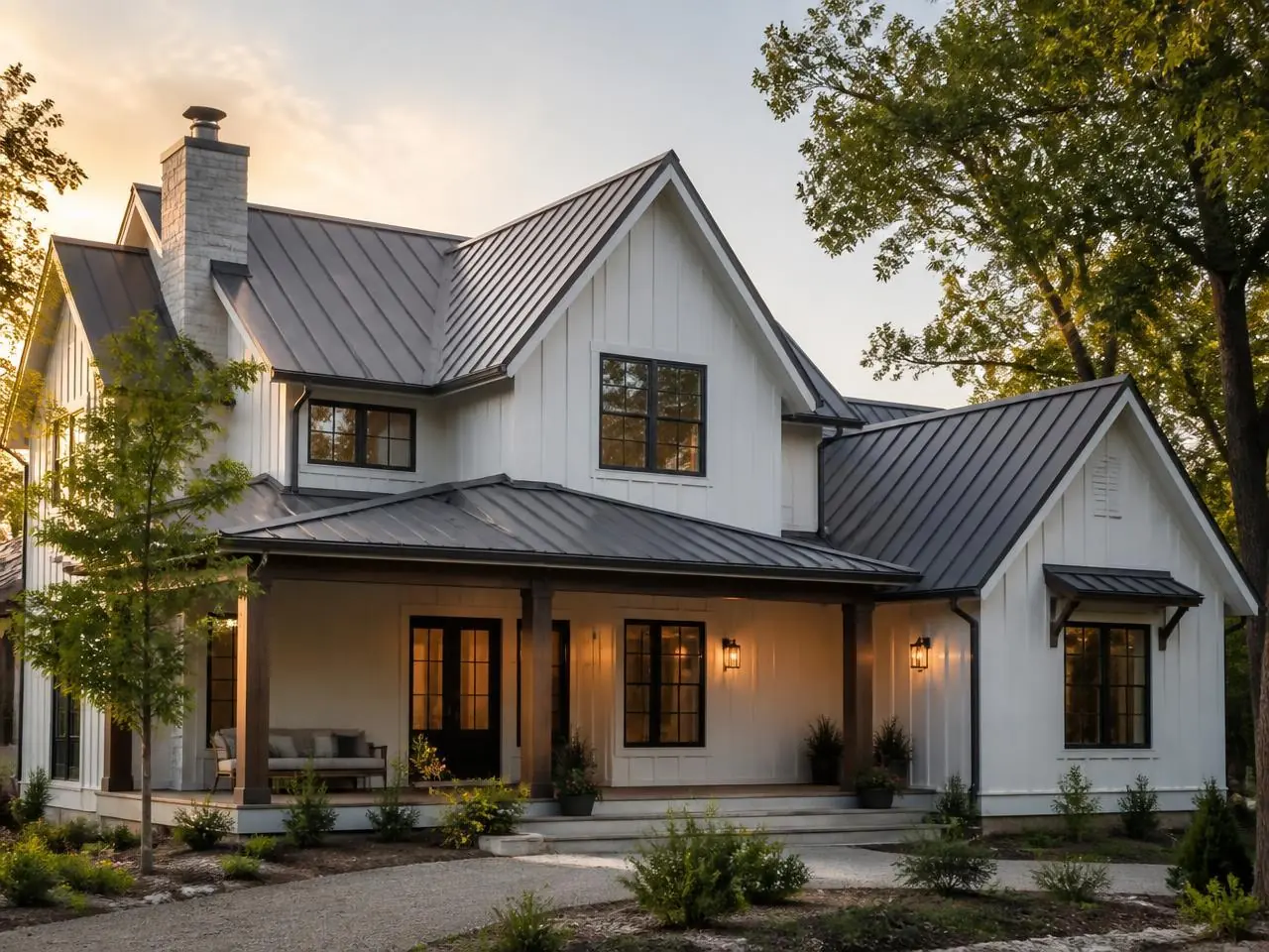 Dark standing seam metal roof installed on a white modern farmhouse near Ball Ground, GA